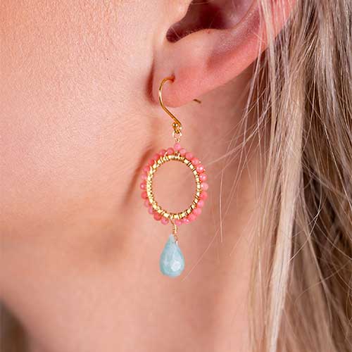 Coral beaded hoop earrings with blue drop